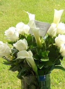 White roses and calla lilies in vase