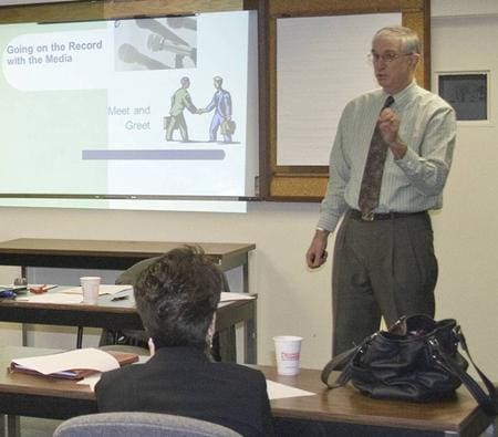 Workshop instructor Denis Sweeney highlights specific subject matter during his seminar on Going on the Record with the Media.