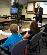 Seminar instructor Denis Sweeney leads discussion during a workshop sponsored by Sweeney Enterprises LLC.